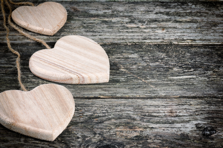 Rustic hearts on old wood with copyspaceの写真素材