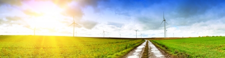 Panoramic landscape with country road and wind turbinesの写真素材