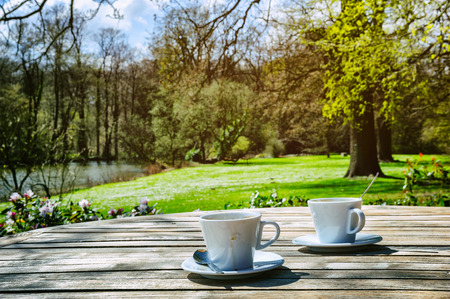 Two cups of coffee in outdoor settingの写真素材