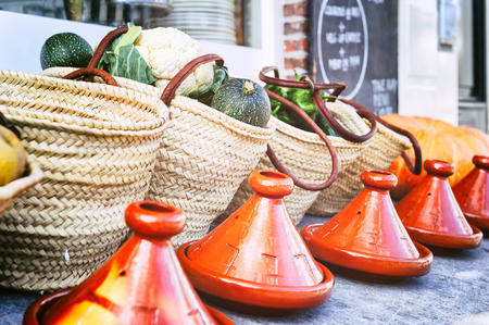 Fresh vegetables in wicker baskets outside of small restaurantの写真素材