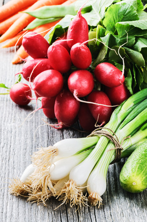 Fresh organic vegetables in rustic settingの写真素材