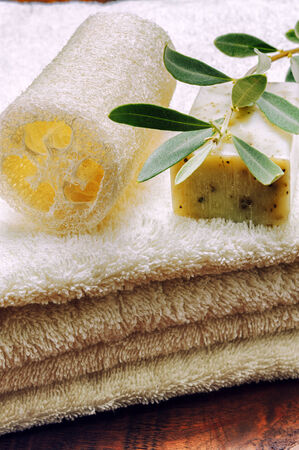 Rustic setting with natural olive soap and organic spongeの写真素材