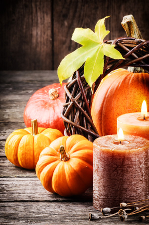 Autumn still-life in orange tone with pumpkins and candlesの写真素材