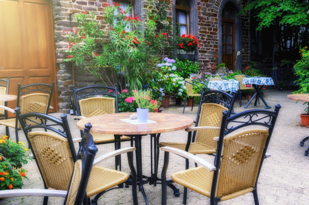 Cafe terrace in small European city at summer day