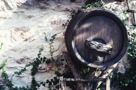 Old wooden wine barrel used as outdoor decoration