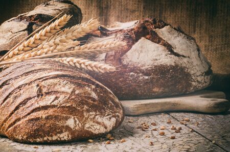 Selection of freshly baked bread in rustic setting with copyspaceの写真素材