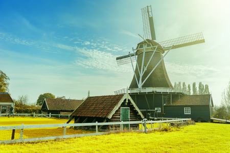 Summer landscape with traditional dutch windmill. Old farm conceptの写真素材