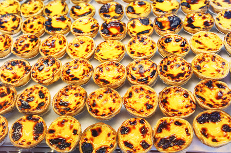 Traditional portuguese pastry - pastel de nata in cafe showcaseの写真素材