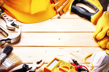 Frame with various tools on wooden background. Construction concept with copyspaceの写真素材