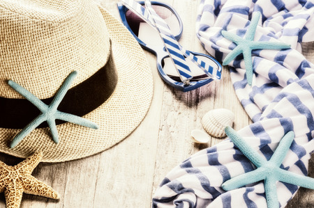 Summer holiday setting with straw hat and sunglasses. Copy spaceの写真素材