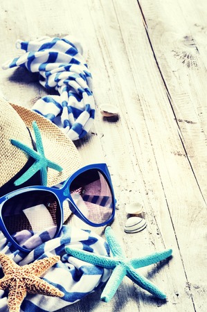 Summer holiday setting with straw hat and sunglasses. Copy spaceの写真素材
