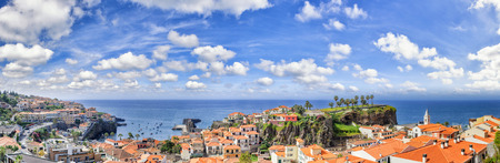 Panoramic landscape with view of Camara de Lobos, small fisherman village on Madeira island. Copy spaceの写真素材