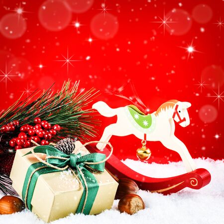 Christmas ornaments in vintage style over red festive backgroundの写真素材