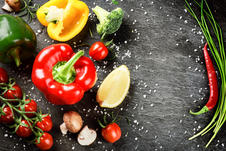 Frame with fresh organic vegetables and herbs. Healthy eating and cooking conceptの写真素材