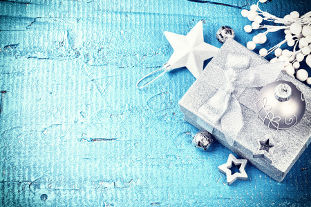 Christmas holiday setting with present and festive decorations in white and silver tone. Christmas background with copy space, top viewの写真素材