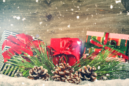 Christmas holiday setting with presents in boxes over snow. Christmas background with copy spaceの写真素材
