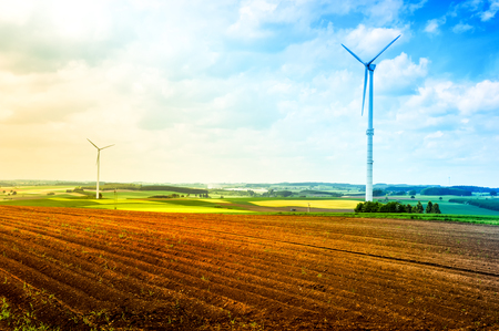 Country landscape with wind turbines and agricultural fields. Nature backgroundの写真素材