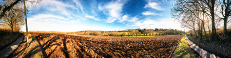 Panoramic agricultural landscape with ploughed field. Country nature backgroundの写真素材
