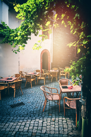 Cafe terrace in small European city at sunny summer day. Food industryの写真素材