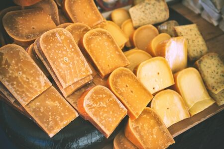Selection of Dutch cheese at farmers traditional market. Food backgroundの写真素材