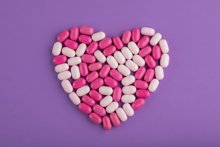 Candy Heart on Purple Background
