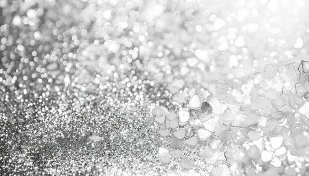 Silver glitter vintage lights background. silver and white. defocused.の素材