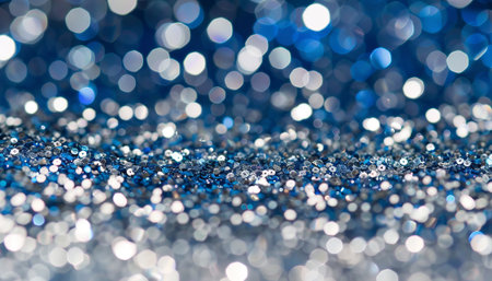 Blue glitter christmas abstract background with bokeh defocused lightsの素材