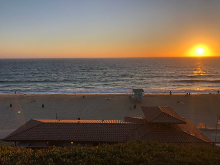 Sunset Over the Tranquil Beach, Capturing a Serene Evening by the Ocean's Edge in a Picturesque Coastal Locationの写真素材