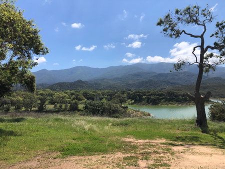 Mountain landscape with lake and blue sky, Cachuma Lake, CAの写真素材