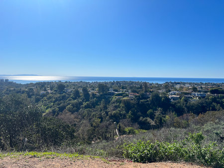 Scenic View of Coastal Landscape Under Bright Blue Sky Capturing Nature's Beauty in a Peaceful Settingの写真素材