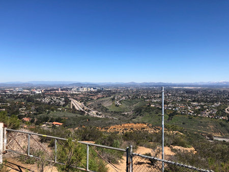 Scenic Vista Overlooking the Valley and Cityscape on a Clear Sunny Dayの写真素材
