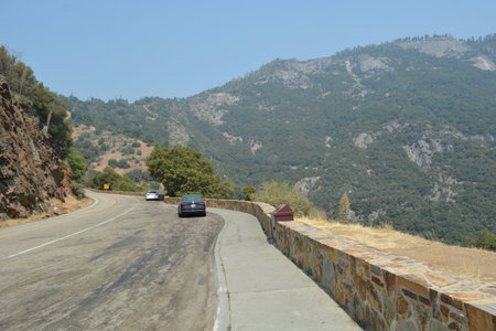 Scenic Mountain Drive Reveals Stunning Vistas and Winding Roads on a Bright Summer Dayの写真素材