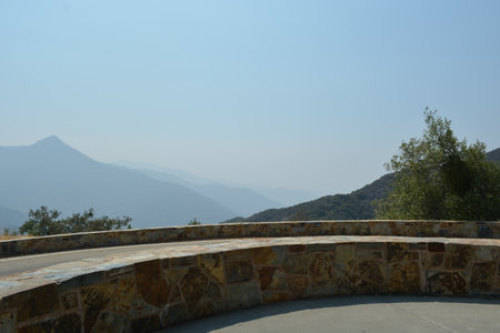 Rolling Hills and Distant Mountains Create a Serene View From the Stone Overlook at Middayの写真素材