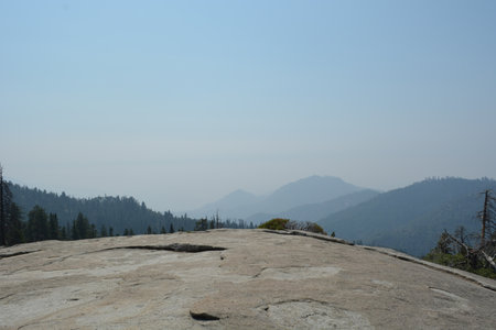 Breathtaking View From a Rocky Outcrop Overlooking a Valley on a Hazy Day in the Wildernessの写真素材
