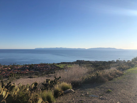 Scenic Coastal View of Islands and Vibrant Landscape Near the Shore at Duskの写真素材