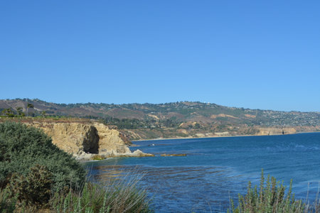 Scenic Coastal View Showcasing Cliffs and Clear Blue Water on a Sunny Day in Californiaの写真素材
