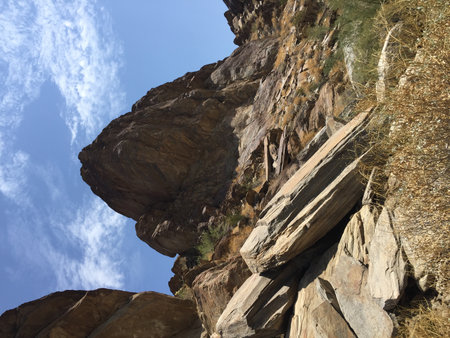Majestic Rock Formations Under a Bright Blue Sky in a Serene Desert Landscapeの写真素材