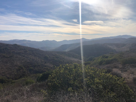 Vast Hills and Serene Skies Create a Peaceful Escape Into Nature's Beauty in the Afternoon Lightの写真素材