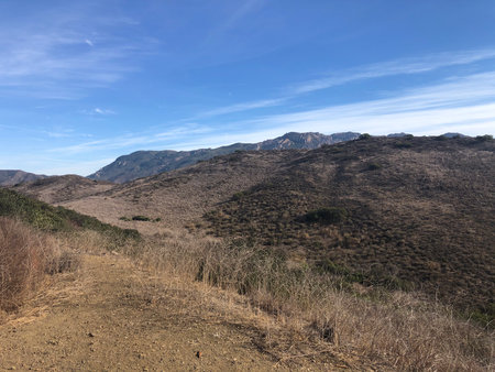 Scenic Mountain Landscape Under a Clear Blue Sky During a Sunny Dayの写真素材