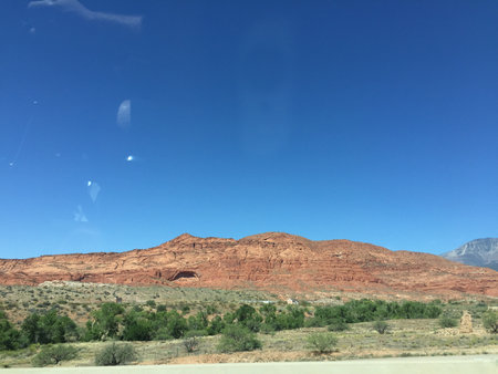 Majestic Red Rock Formations Under a Bright Blue Sky in the American West During Afternoon Lightの写真素材