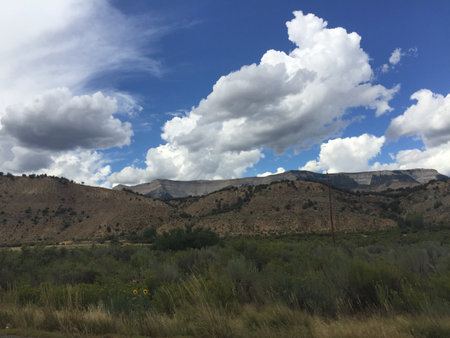 Mountains and blue sky with white clouds in the desert of Arizonaの写真素材