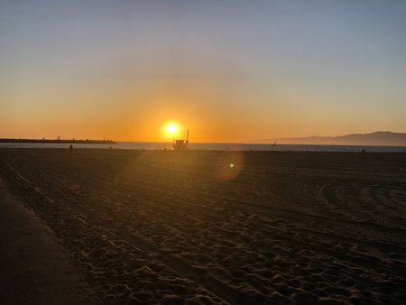 Sunset Over the Serene Beach With a Colorful Skyの写真素材