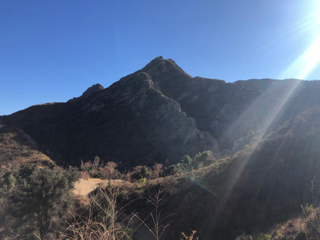 Majestic Mountain Landscape Under a Clear Blue Sky Showcasing Serene Nature at Its Bestの写真素材