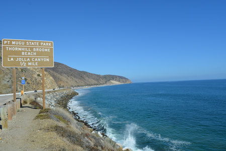 Scenic View of the Pacific Coastline at Pt Mugu State Park With Signs Guiding to Beach and Canyonの写真素材
