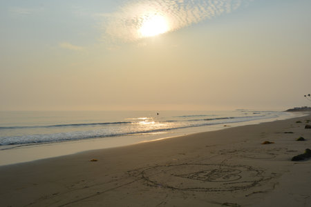Sunlight Glimmers Over the Gentle Waves as a Peaceful Beach Scene Embraces the Tranquil Dusk of a Serene Coastal Momentの写真素材