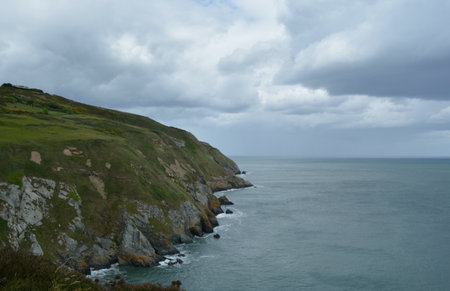 Scenic Coastal View With Dramatic Cliffs and Overcast Skies During an Afternoon Stroll Along the Shoreの写真素材