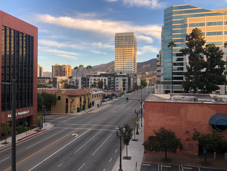 Cityscape Under the Evening Sky Showcases the Quiet Streets and Modern Buildings of Downtownの写真素材