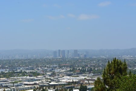 View of a Bustling City Skyline From a High Vantage Point Under a Clear Blue Skyの写真素材