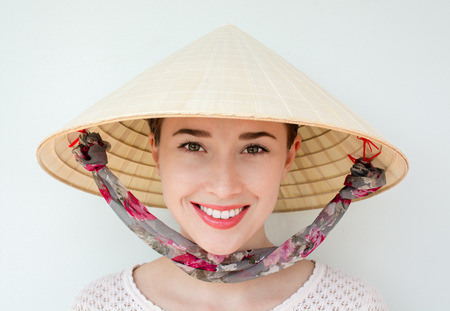 Girl at Vietnam hat with a beautiful smileの写真素材