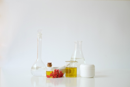 laboratory experiment and research with leaf, oil and ingredient  extract for natural beauty and organic skincare product the blank bottle for label ,bio science concept. alternative medicine. spa.の写真素材